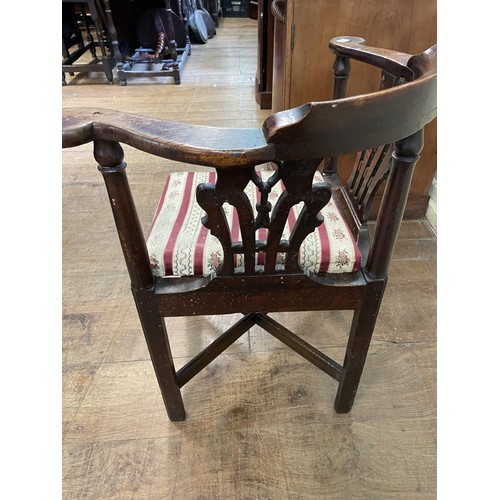 769 - A 19th century corner chair, with a pierced splat back, drop in seat and square legs