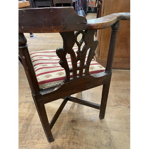 769 - A 19th century corner chair, with a pierced splat back, drop in seat and square legs