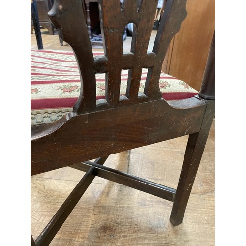 769 - A 19th century corner chair, with a pierced splat back, drop in seat and square legs