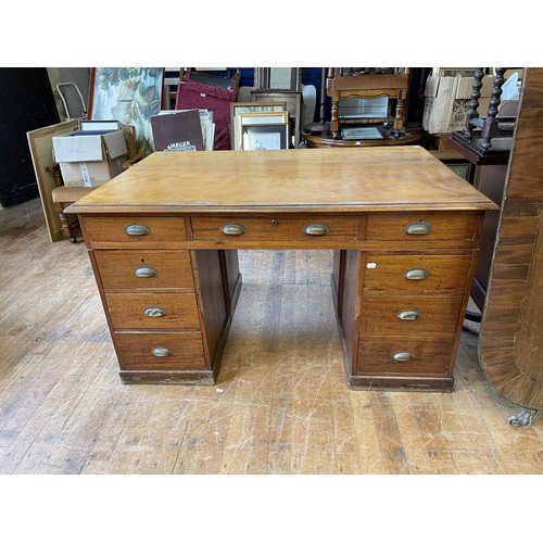 867 - A partners mahogany desk, the top having six drawers on pedestals, with three drawers flanked by a c... 