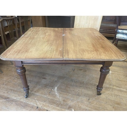 896 - A 19th century mahogany extending dining table, the top 130 x 122 cm, without any leaves