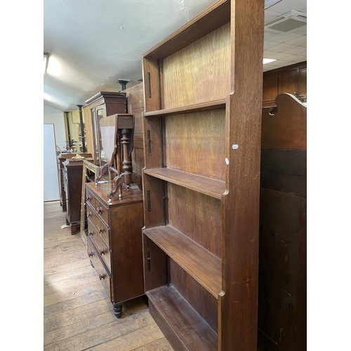 788 - An oak waterfall bookcase, 101 cm wide, a mahogany CD rack, a washstand, a map, two single chairs, a... 