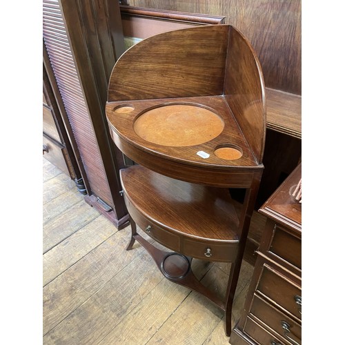 788 - An oak waterfall bookcase, 101 cm wide, a mahogany CD rack, a washstand, a map, two single chairs, a... 