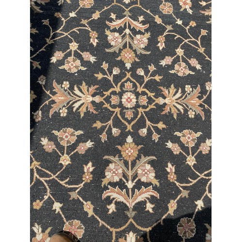 822 - A black ground Persian type carpet, 317 x 240 cm