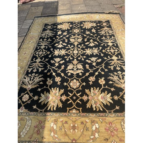 822 - A black ground Persian type carpet, 317 x 240 cm