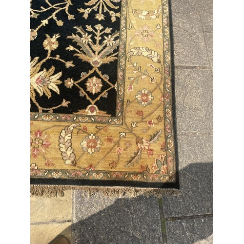 822 - A black ground Persian type carpet, 317 x 240 cm