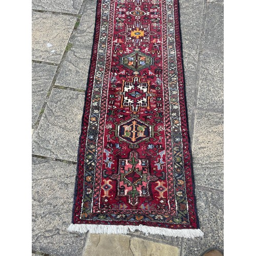 837 - A Persian red ground runner, 270 x 65 cm