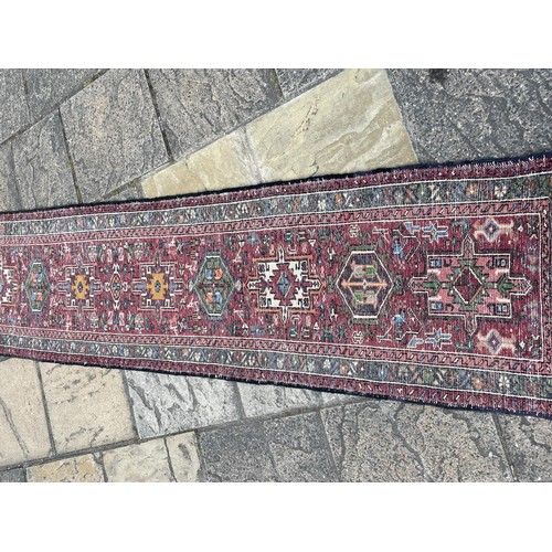 837 - A Persian red ground runner, 270 x 65 cm