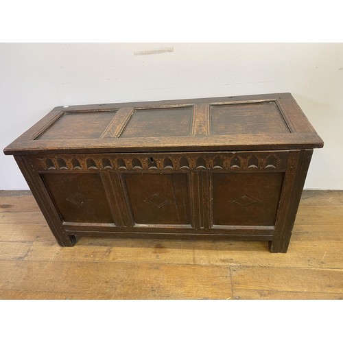 930 - An 18th century oak coffer, 130 cm wide