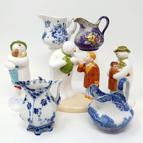 501 - A pair of Dresden figures, marked J P, 17 cm high, four cream jugs, a Coalport Snowman figure, and t... 