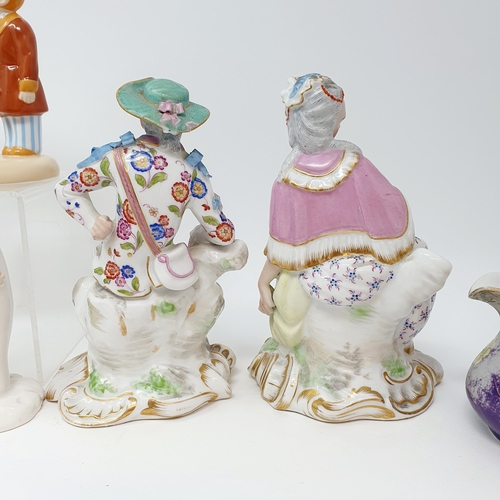 501 - A pair of Dresden figures, marked J P, 17 cm high, four cream jugs, a Coalport Snowman figure, and t... 