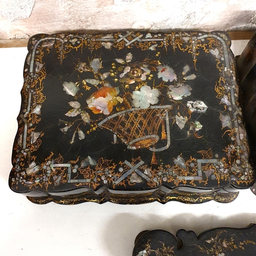 530 - A papier mache writing box, decorated flowers, 27 cm wide, an inkstand, 27 cm wide, lacking ink bott... 