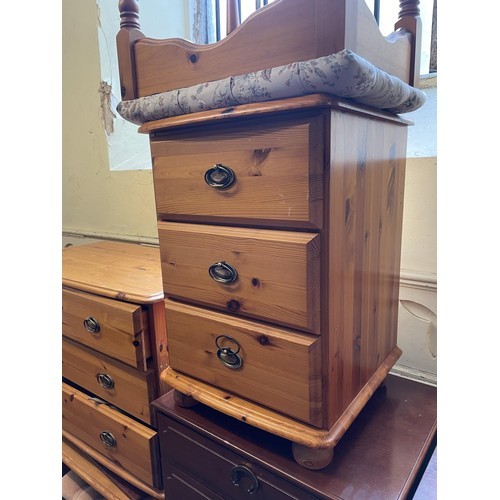 794 - A mahogany bookcase cabinet, 100 cm wide, two single chairs, a pine bedside chest, a pine chest of d... 