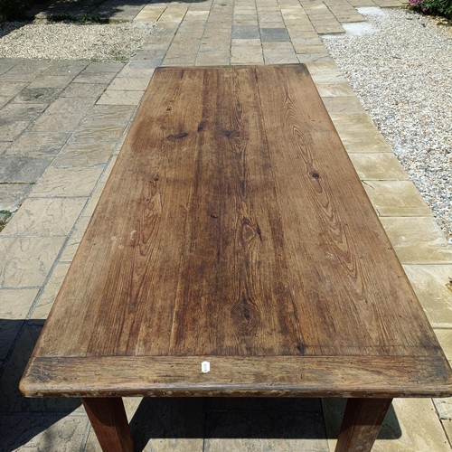 902 - A large pine refectory table, the top 260 x 100 cm