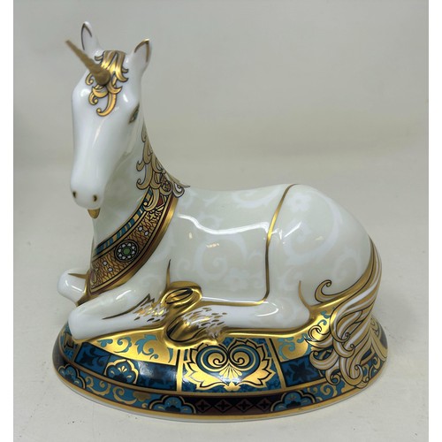 657 - A Royal Crown Derby limited edition paperweight, Unicorn, 1773/2000, 14 cm high, with a certificate,... 