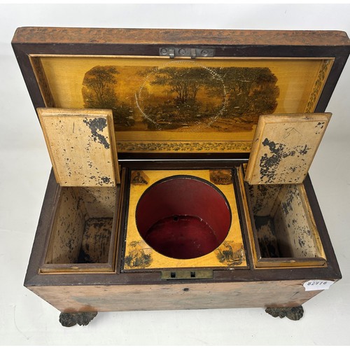 673 - A 19th century satinwood tea caddy, with transfer printed decoration, 32 cm wide