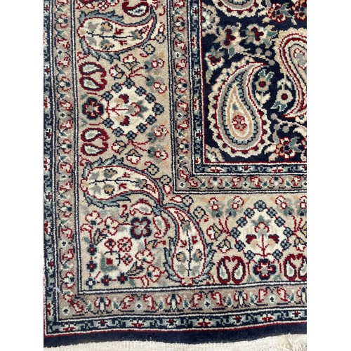 840 - A Persian blue ground rug, repeating teardrop medallion, 180 x 110 cm