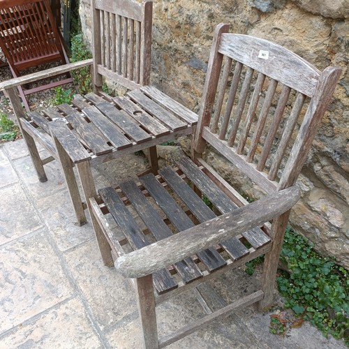 961 - A garden double seat, 142 cm wide