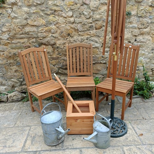 959 - A set of three teak garden chairs, a planter stand, a parasol, and two watering cans (7)