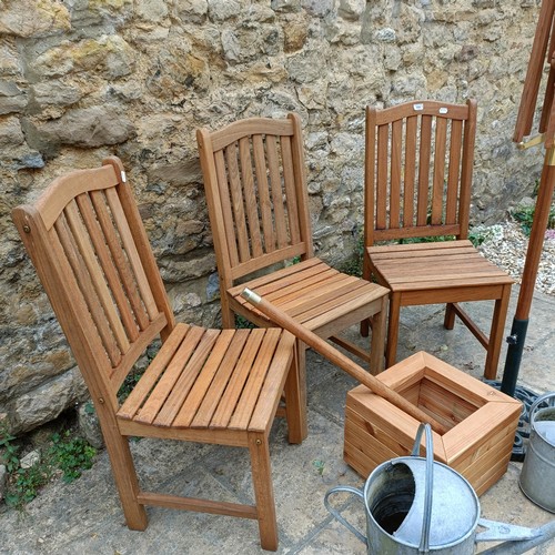 959 - A set of three teak garden chairs, a planter stand, a parasol, and two watering cans (7)