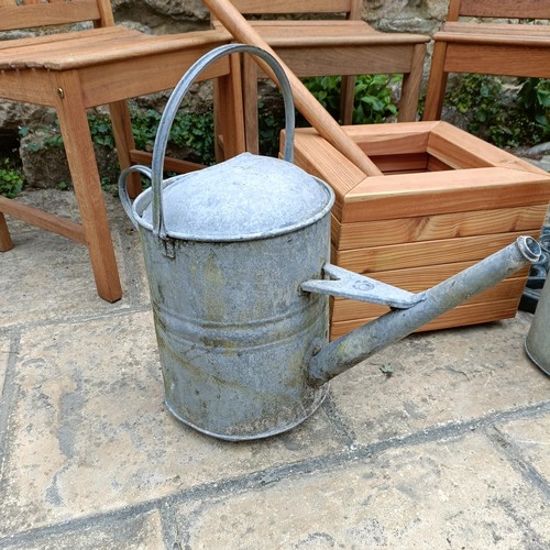 959 - A set of three teak garden chairs, a planter stand, a parasol, and two watering cans (7)