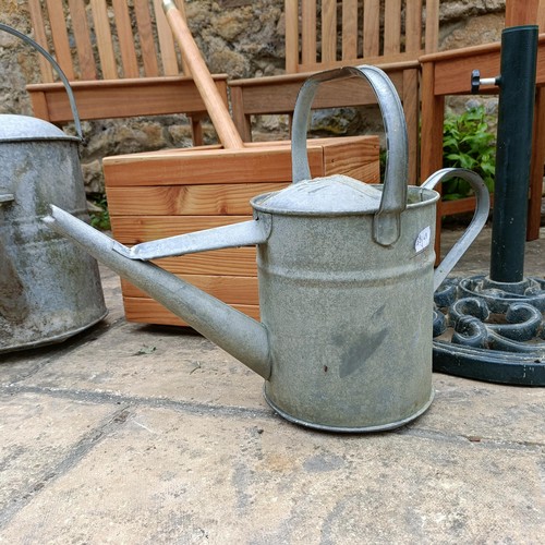 959 - A set of three teak garden chairs, a planter stand, a parasol, and two watering cans (7)