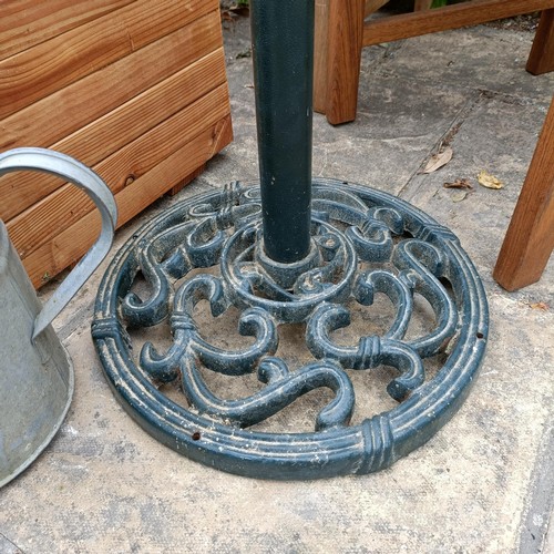 959 - A set of three teak garden chairs, a planter stand, a parasol, and two watering cans (7)