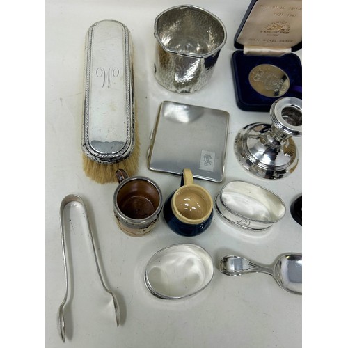 691 - A George V silver cigarette case, three napkin rings, a beaker, two miniature mugs, and assorted oth... 