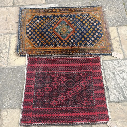 927 - A Persian blue ground rug, 107 x 76 cm, and a red ground rug, 86 x 76 cm (2)