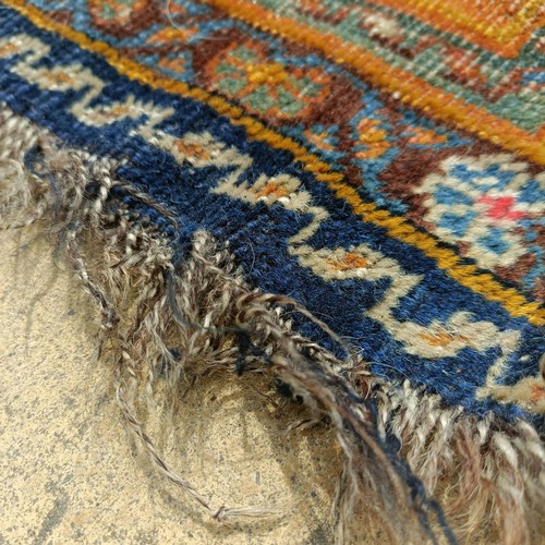 927 - A Persian blue ground rug, 107 x 76 cm, and a red ground rug, 86 x 76 cm (2)