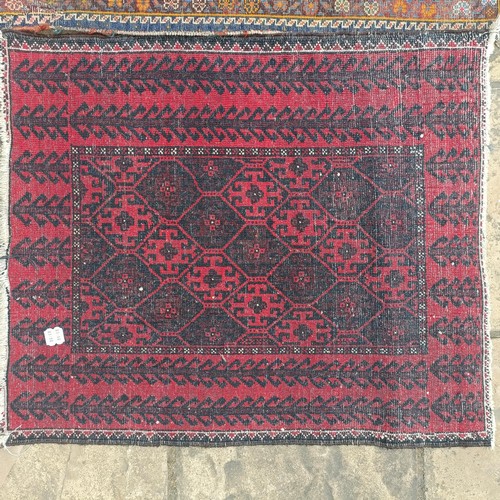 927 - A Persian blue ground rug, 107 x 76 cm, and a red ground rug, 86 x 76 cm (2)