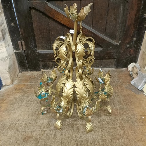 921 - A gilt metal chandelier, decorated leaves, 56 cm diameter