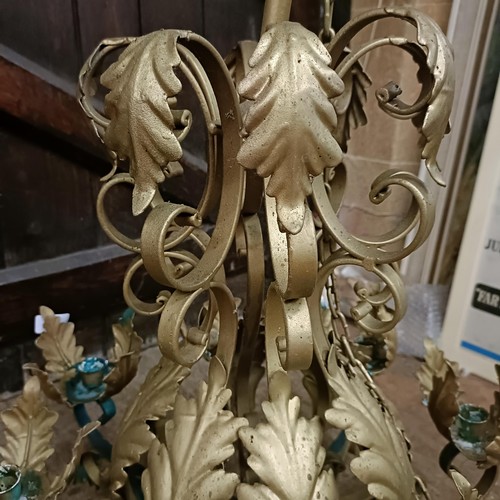 921 - A gilt metal chandelier, decorated leaves, 56 cm diameter