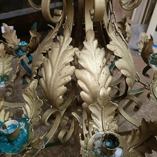 921 - A gilt metal chandelier, decorated leaves, 56 cm diameter