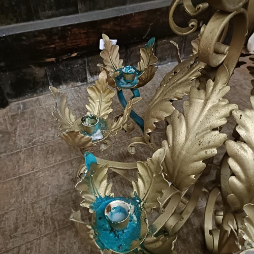 921 - A gilt metal chandelier, decorated leaves, 56 cm diameter