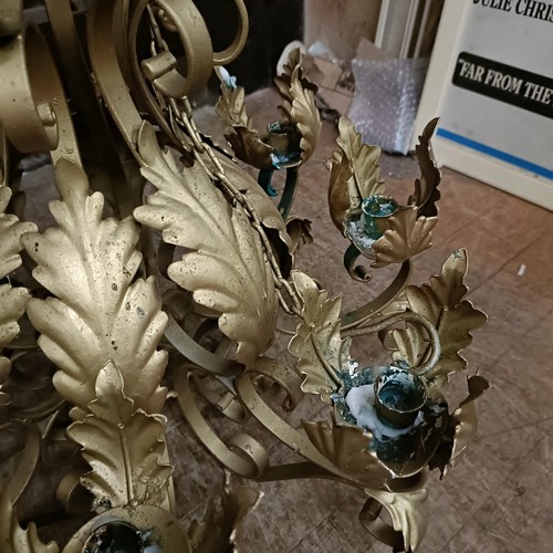 921 - A gilt metal chandelier, decorated leaves, 56 cm diameter