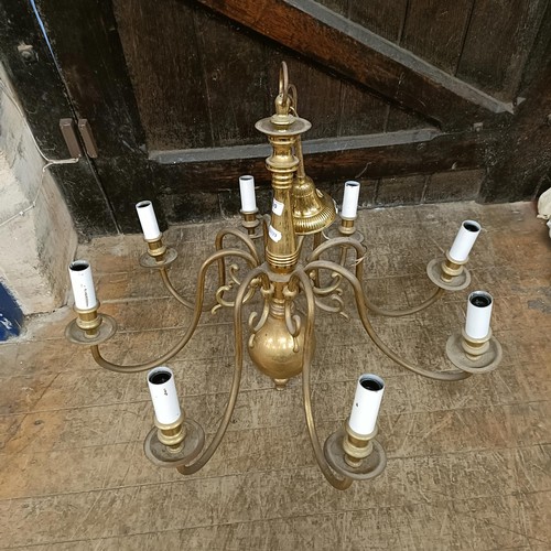 920 - A Dutch style eight branch brass chandelier, 70 cm diameter