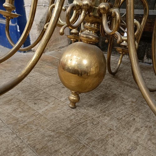 920 - A Dutch style eight branch brass chandelier, 70 cm diameter