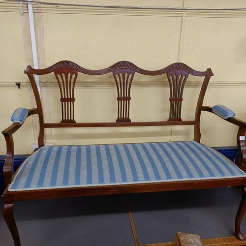 918 - A mahogany framed three seater settee, with upholstered arms and seat, on cabriole legs, 127 cm wide... 