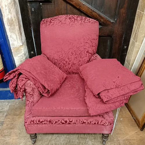 901 - A red upholstered armchair, and matching curtains