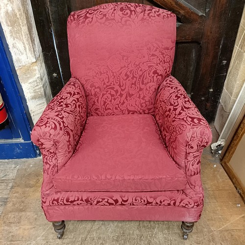 901 - A red upholstered armchair, and matching curtains