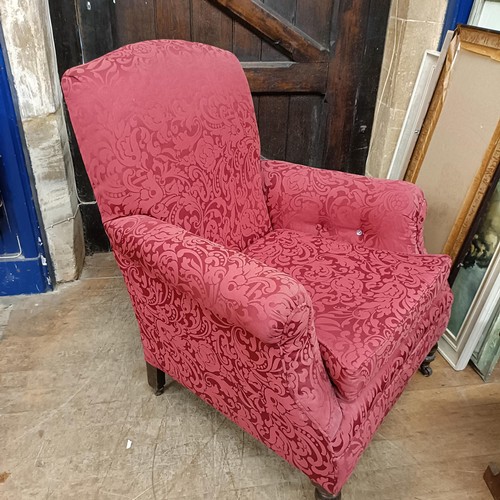 901 - A red upholstered armchair, and matching curtains