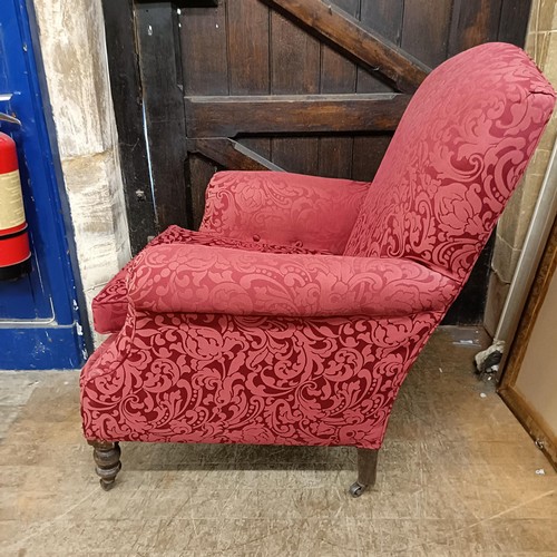 901 - A red upholstered armchair, and matching curtains