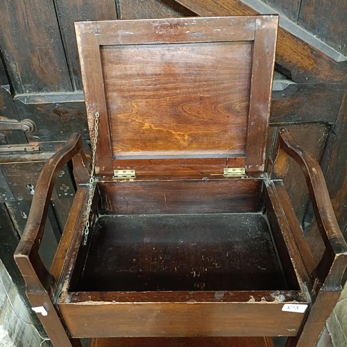 898 - A mahogany piano stool, and a music cabinet