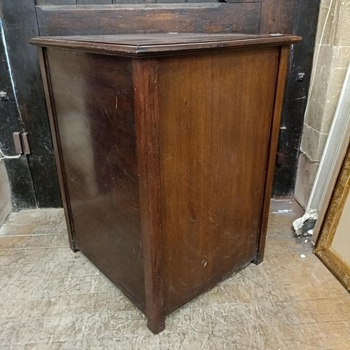 898 - A mahogany piano stool, and a music cabinet