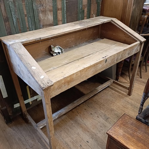 890 - A clerks pine desk, 150 cm wide, a pine kitchen table, a Lloyd Loom chair, and an oak table (4)