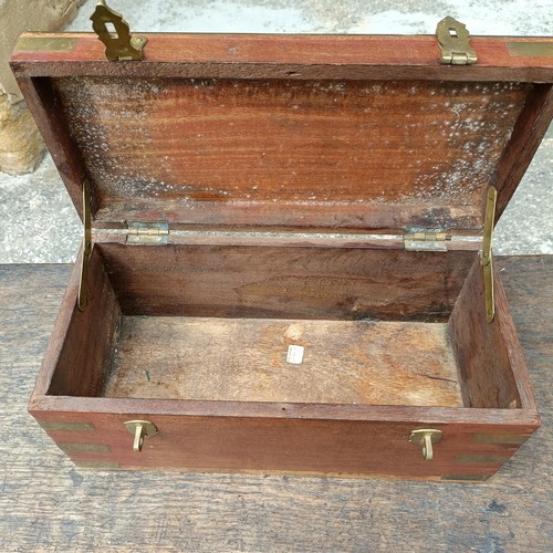 786 - An oak coffer of plank construction, in very poor order, 113 cm wide, a camphorwood and brass bound ... 