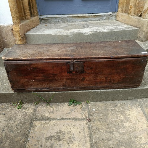 786 - An oak coffer of plank construction, in very poor order, 113 cm wide, a camphorwood and brass bound ... 