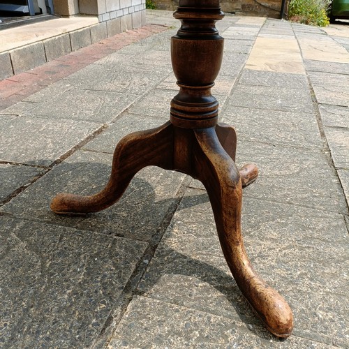 791 - A mahogany tripod table, with a shaped top, 84 cm diameter