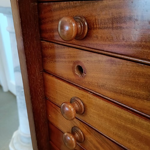 819 - A 19th century mahogany collectors cabinet, with a glazed door to reveal twenty drawers, one missing... 